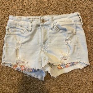 Light blue Jean shorts with floral pockets